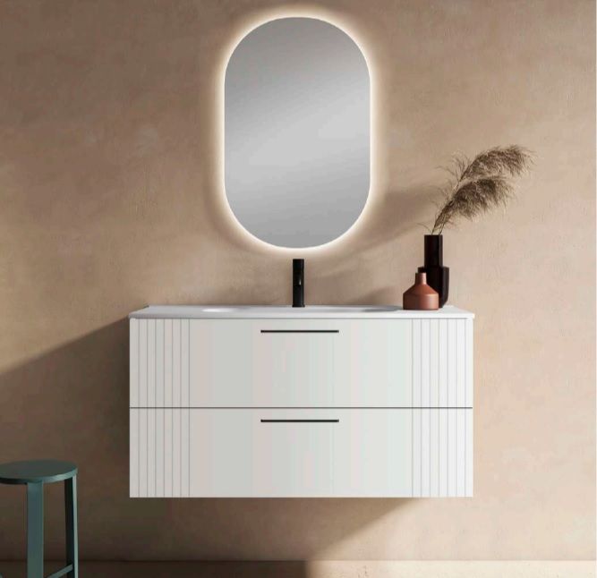 mueble blanco y espejo oval con luz